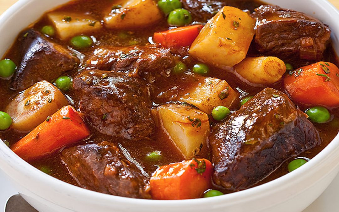 Irish Stew In A Bowl. Made From Meat, Carrots, Potatoes, Peas In A Gravy Sauce.