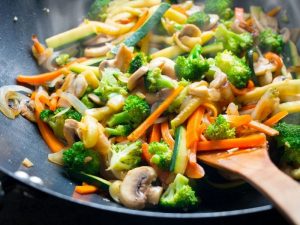 Vegetable Stir Fry Mushrooms Carrots Onion Broccoli all Cut into Similar Sizes for Easy Cooking