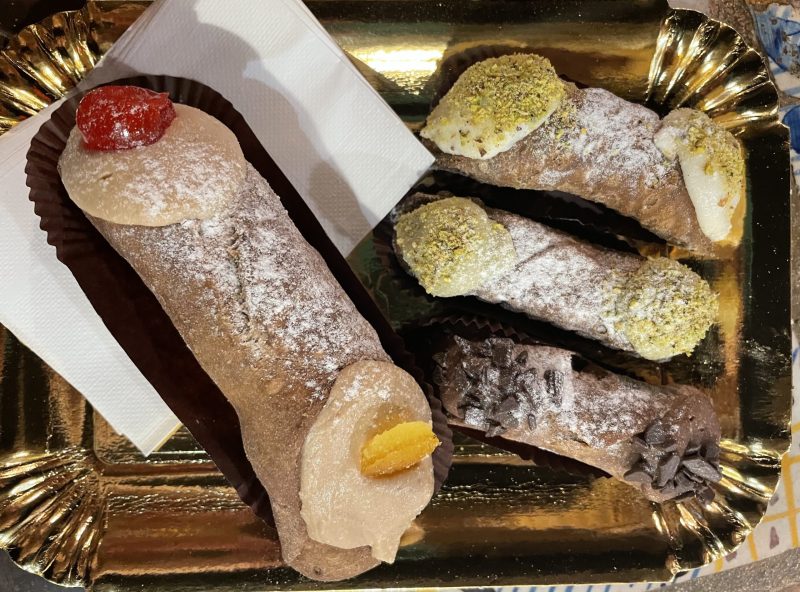 Sweet Cannoli, cooked dough filled with cream is a traditional Italian dish.