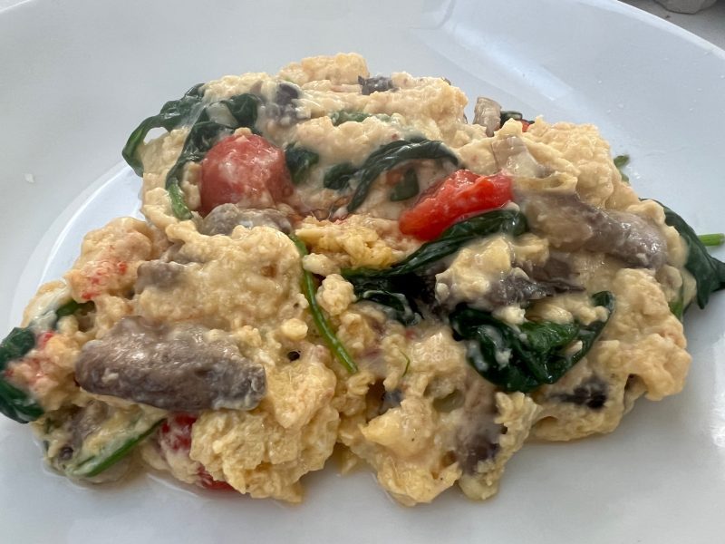 Loaded Scrambled Eggs with mushroom, tomato and spinach.
