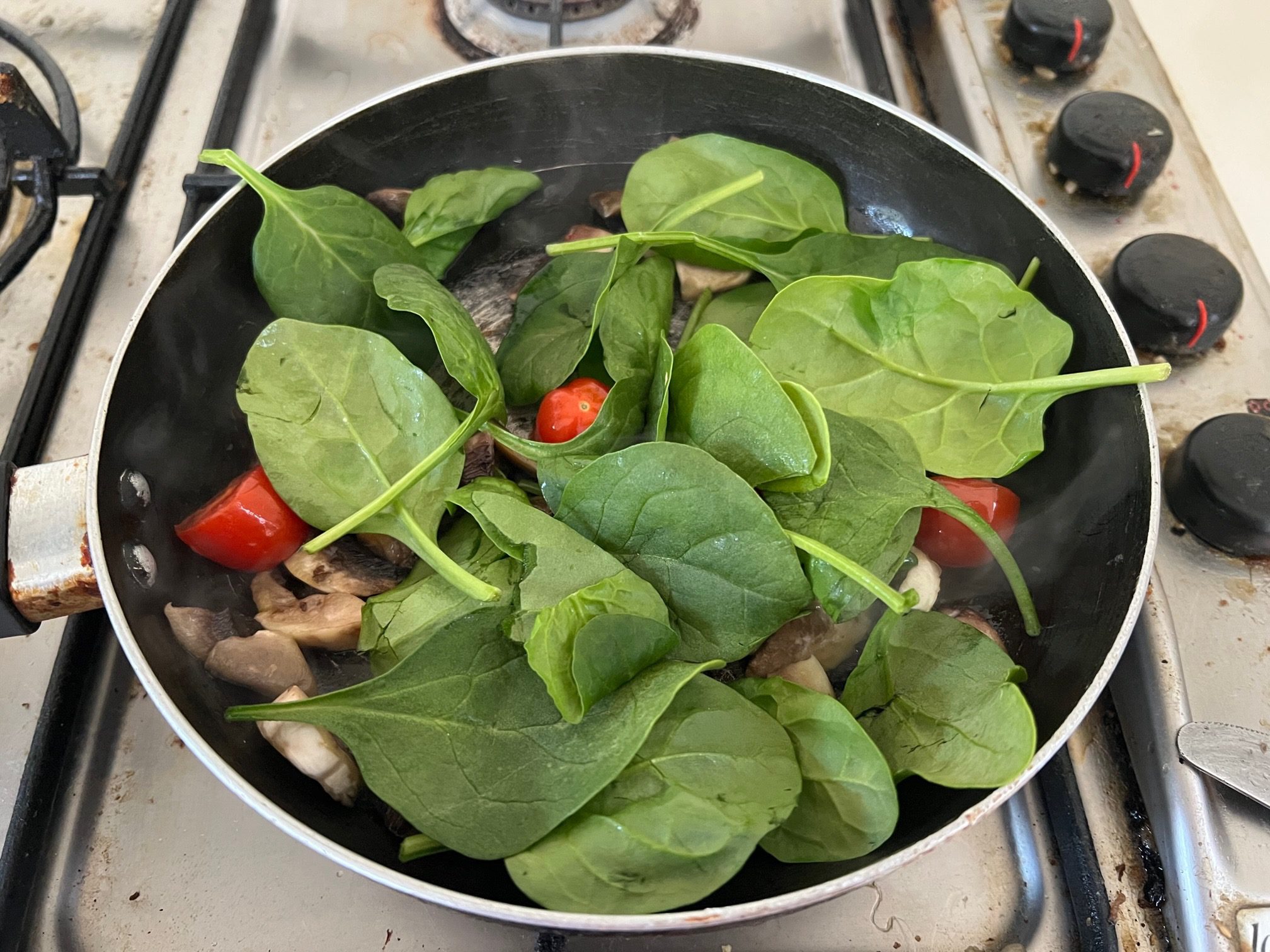 add spinach to mushroom and tomato mixture and cook.