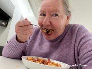 Sharyn eating loaded scrambled eggs.