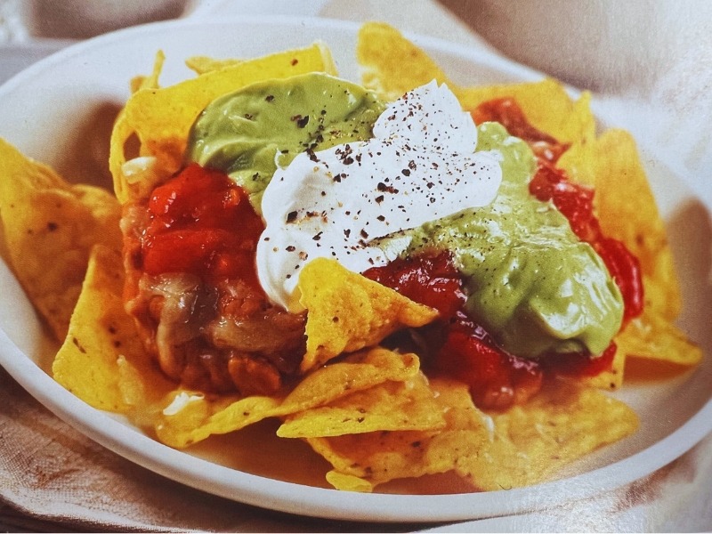 Nachos - tortilla chips, salsa, guacamole and sour cream.